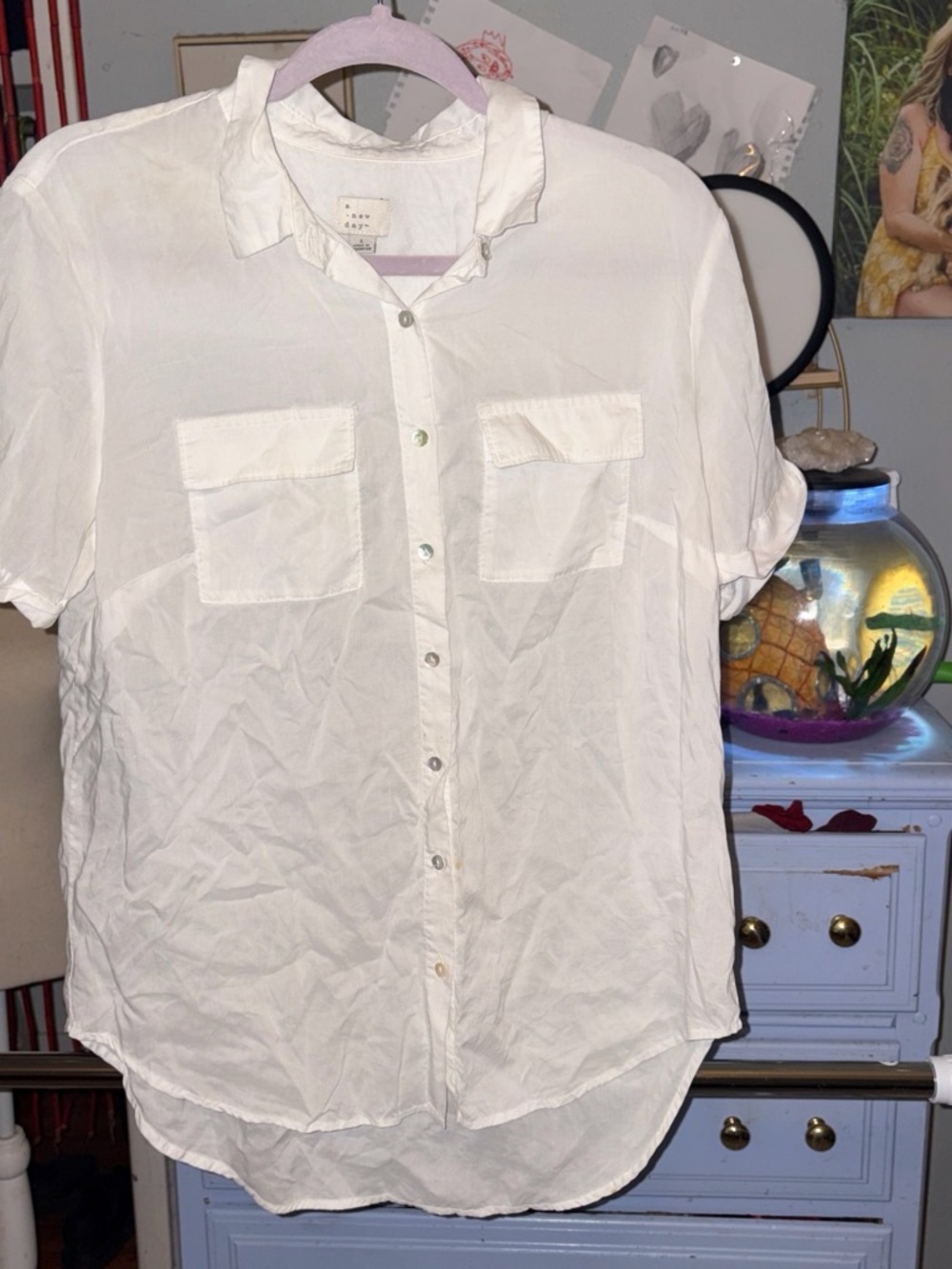 woman’s  White Short-Sleeve Button-Up Shirt